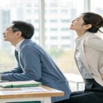 八王子で増えている腰痛に悩む男女のイメージ写真